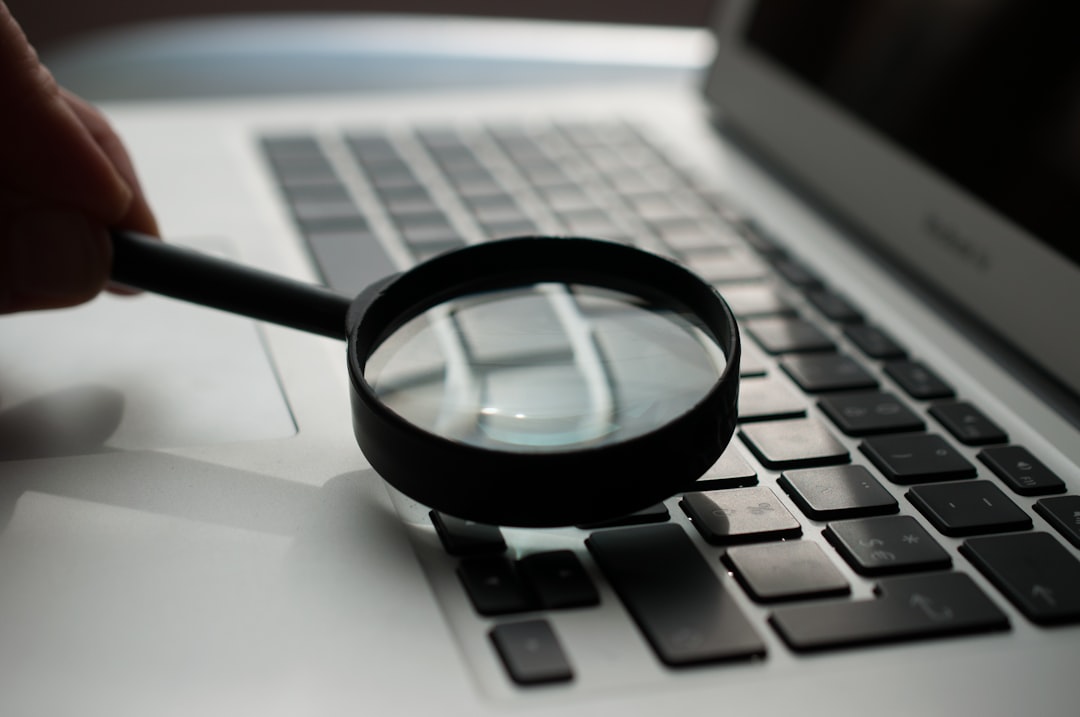 Digital forensics analyst examining computer hard drive evidence in a professional investigation lab