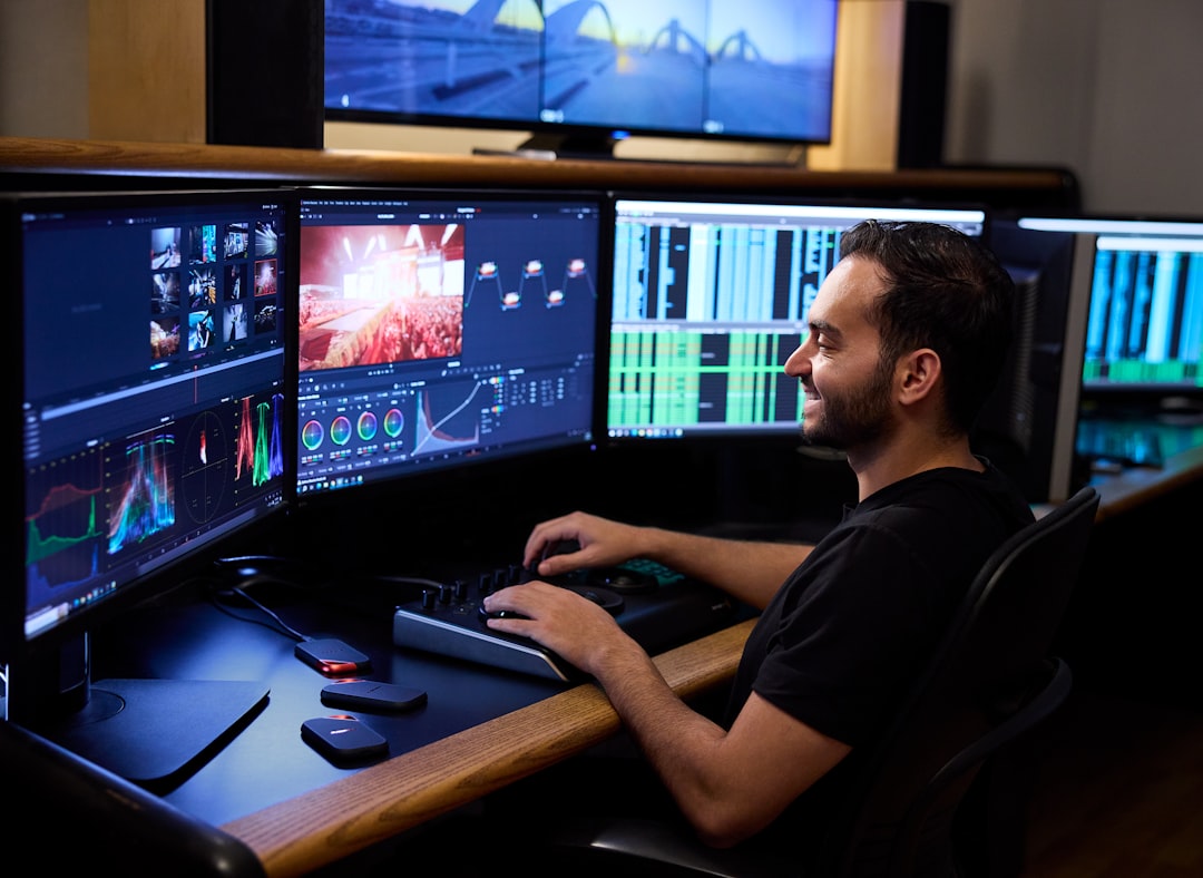 Data engineer analyzing Big Data pipelines and real-time analytics on multiple monitors